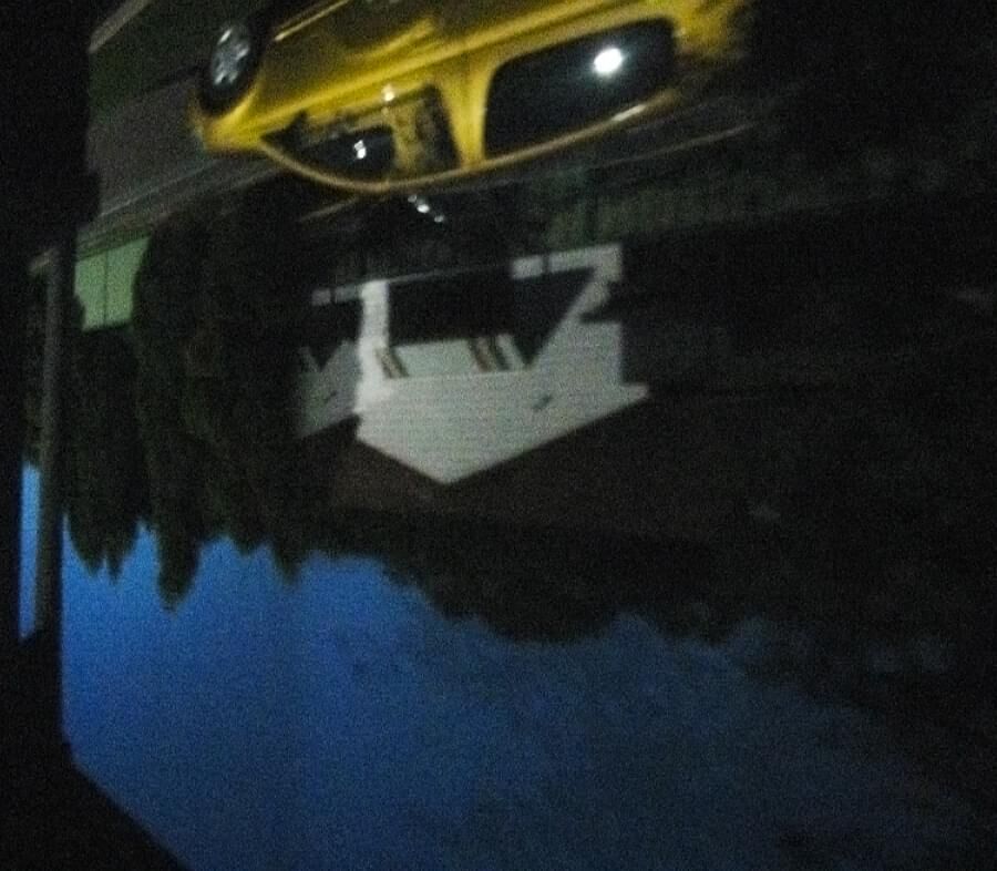 yellow car in front bedroom camera obscura